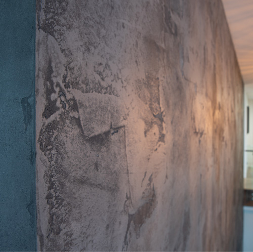 Tadelakt feature wall in dark grey, rough finish with water based polyurethane sealer.